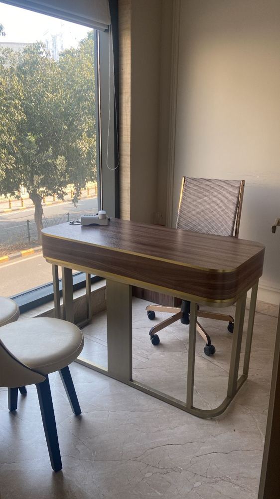 Consultation desk beside a full-height window