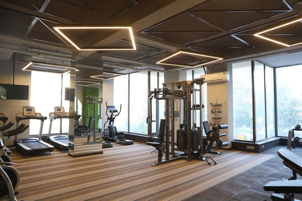 Gym with timber floor and floor-to-ceiling windows
